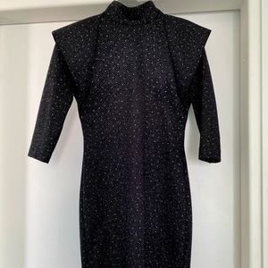 Trendy high shoulders dress! Black dress with sparkles.